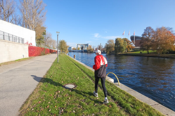 man run along the river