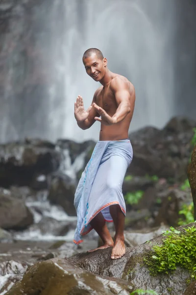 Handsome man at waterfall — Stock Photo, Image