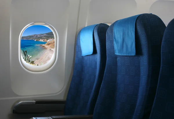 Airplane seat and window — Stock Photo, Image