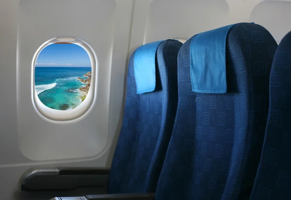 Airplane seat and window — Stock Photo, Image