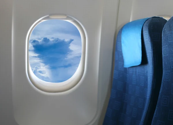 Airplane seat and window — Stock Photo, Image