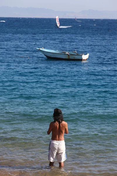 Man in red sea — Stock Photo, Image