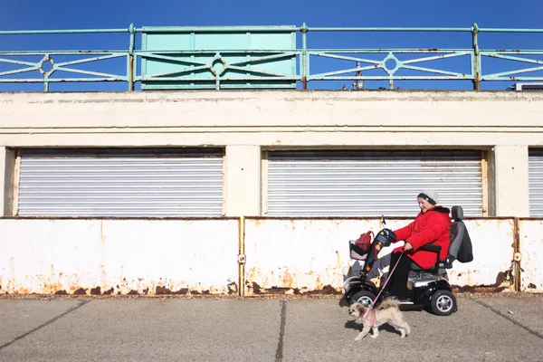 Disabled woman in electric wheel chair — Stock Photo, Image