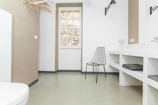 Big comfortable toilet room with chair — Stock Photo, Image