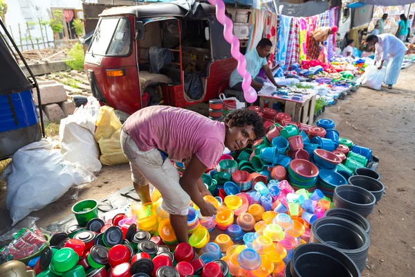 Local street vendor selling plastic products — Stock Photo, Image