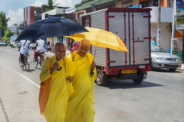 Local monks in traditional yellow robes — Stock Photo, Image