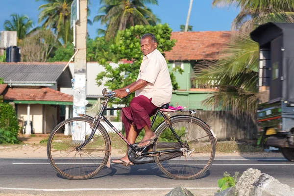 Local man riding a bicycle — Stock Photo, Image