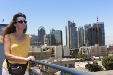 A Woman Overlooking Little Italy, San Diego clipart