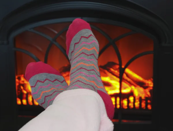 A Pair of Feet and a Cozy Fire — Stock Photo, Image