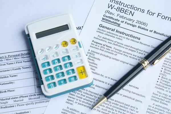 U S Tax form, pen and calculator — Stock Photo, Image