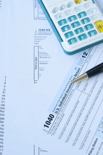 U S Tax form, pen and calculator — Stock Photo, Image
