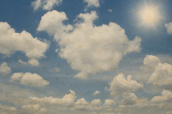 Nuvens em um papel texturizado, vintage — Fotografia de Stock