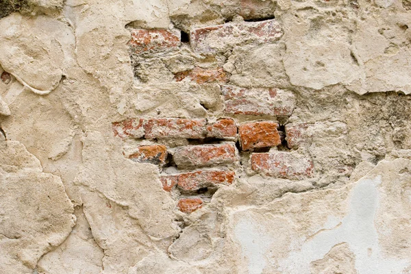 Vieja pared de ladrillo con agrietado — Foto de Stock