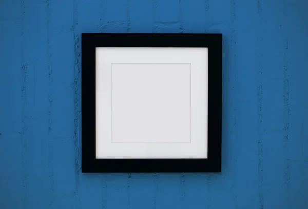 Black wood frame on the wall — Stock Photo, Image