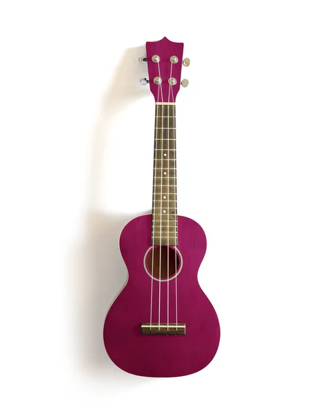 Viejo ukelele rosa sobre blanco aislado . — Foto de Stock