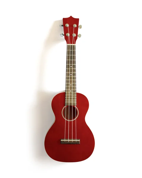 Czerwony ukulele stary biały na białym tle. — Zdjęcie stockowe
