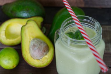Avocado smoothie healthy food on wooden table background