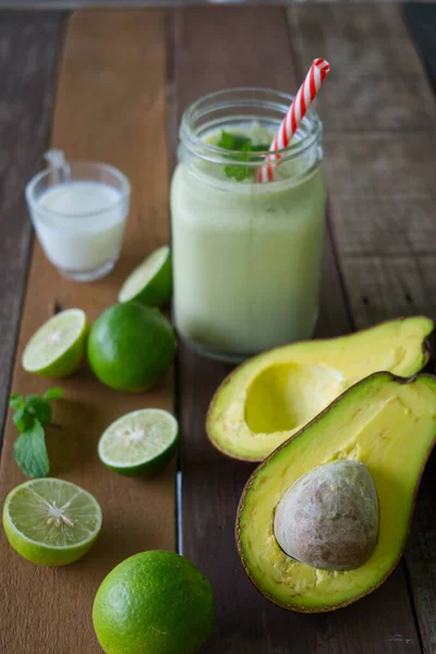 Avocado smoothie healthy food on wooden table background