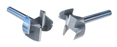 Professional metal Forstner drill bits isolated on a white background. Sharp drilling tools of high speed steel with center brad point and two radial cutting edges to boring flat-bottomed holes in wood.