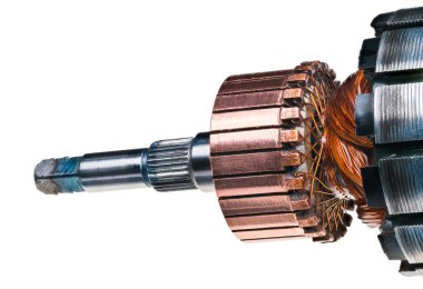 Detail of electrical DC motor rotor isolated on a white background. Copper commutator and coil wire winding attached to steel laminations of blender engine with grooving for fan and square end of shaft.