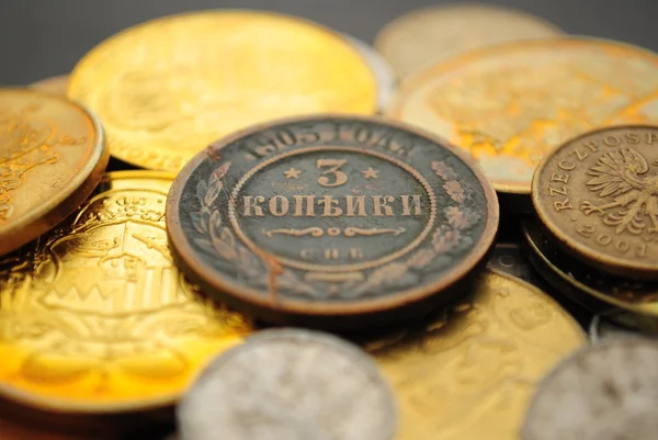 Många olika mynt Stockbild