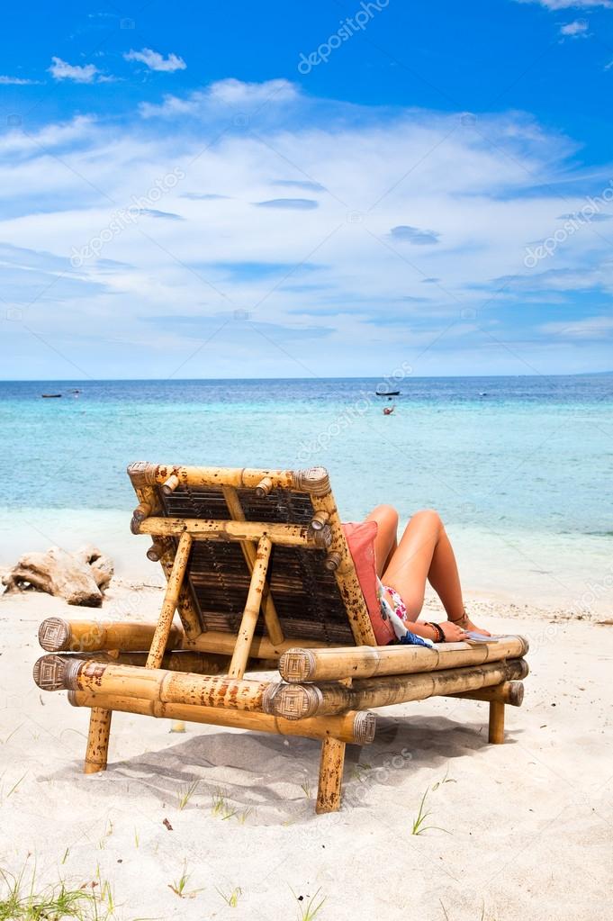 Woman enjoying on a tropical beach
