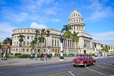 Classic cars in front of the Capitol in Havana. clipart
