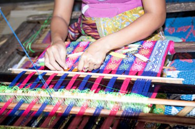 Sasak tribe lady weaving, Lombok clipart