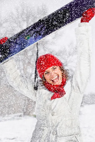 Beautiful woman with snowboard on the snow day — Stock Photo, Image