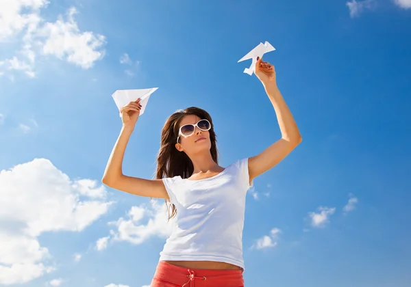 Young caucasian girl with two paper planes — Stock Photo, Image