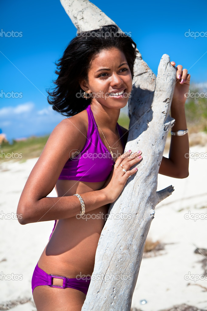 Beautiful caribbean woman on tropical beach