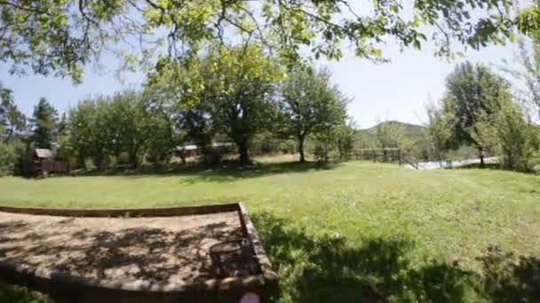 On the swings. Fish-eye view — Stock Video