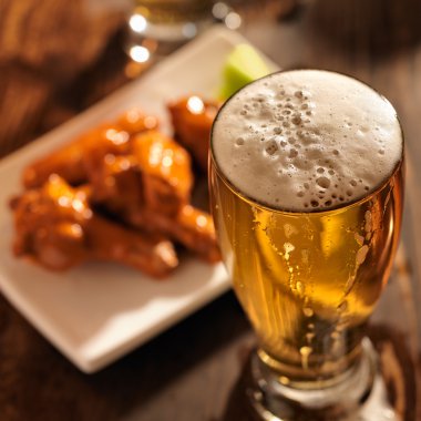 beer and chicken wings close up clipart