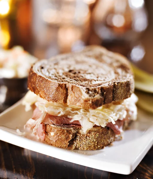 Reuben sandwich with kosher dill pickle and coleslaw — Stock Photo, Image