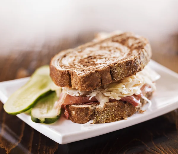 Reuben sandwich with kosher dill pickle and coleslaw — Stock Photo, Image