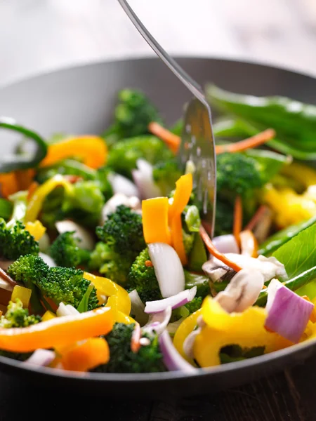 Spatula stirring vegetables — Stock Photo, Image