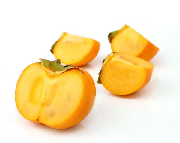 Persimmon tropical fruit slice on half — Stock Photo, Image