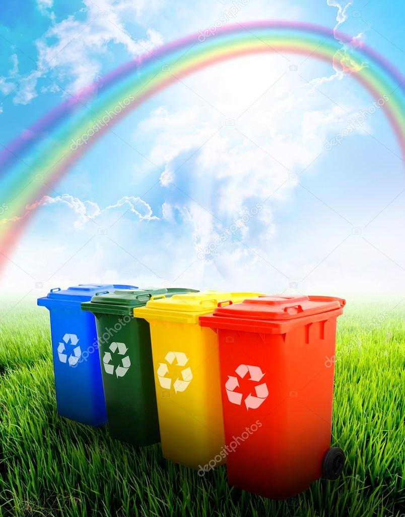 Colorful recycle bins with landscape background