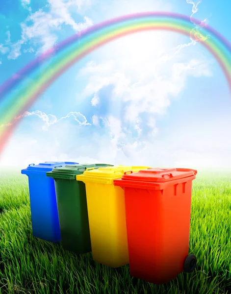 Colorful recycle bins with landscape background — Stock Photo, Image