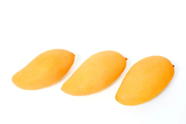 Three ripe golden mangoes — Stock Photo, Image