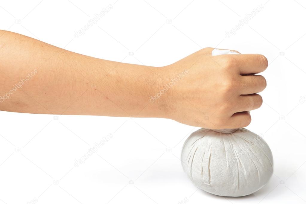 Hand with spa herbal balls 