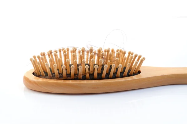Wooden comb brush with lost hair — Stock Photo, Image