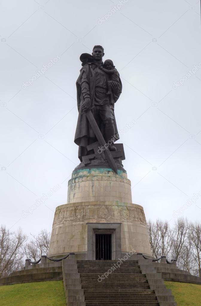 The statue of the Soviet soldier holding a child. Soviet War Memorial in Treptower Park. Berlin, Germany