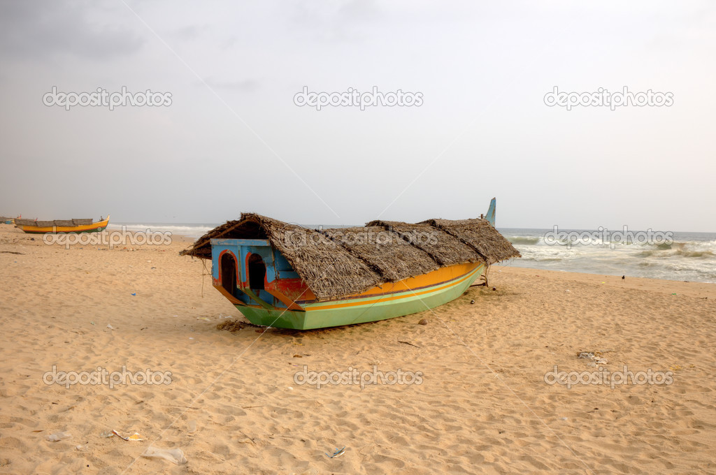 Fishing boat on beach. Kerala, India