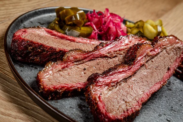 hot appetizer cuts of smoked beef with pickled vegetables american food