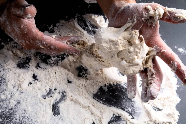 Chef Kneads Dough Dark Background Table Strewn Flour — Stock Photo, Image