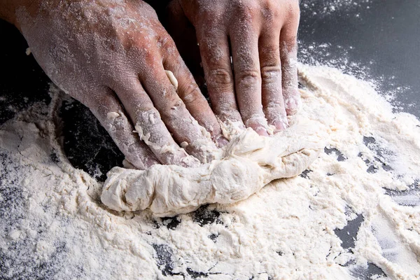 Chef Kneads Dough Dark Background Table Strewn Flour — Foto Stock