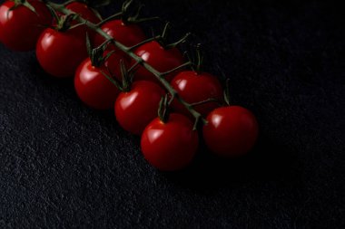 close up cherry tomatoes on dark background