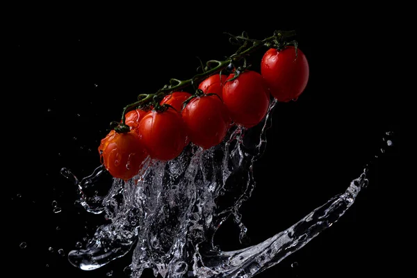 Freeze Motion Cherry Tomatoes Black Background Splashing Water — Fotografia de Stock