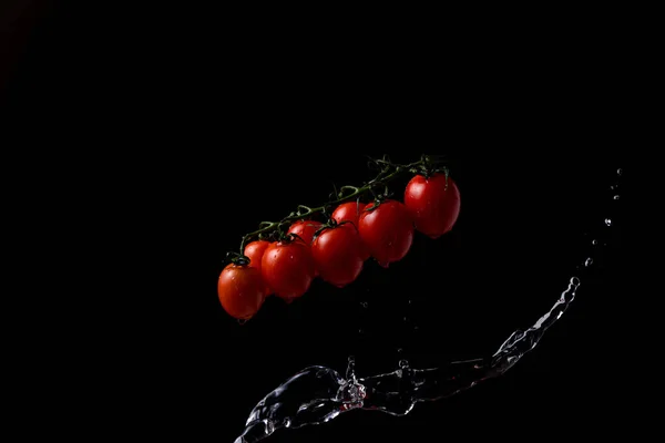 Freeze Motion Cherry Tomatoes Black Background Splashing Water — Fotografia de Stock